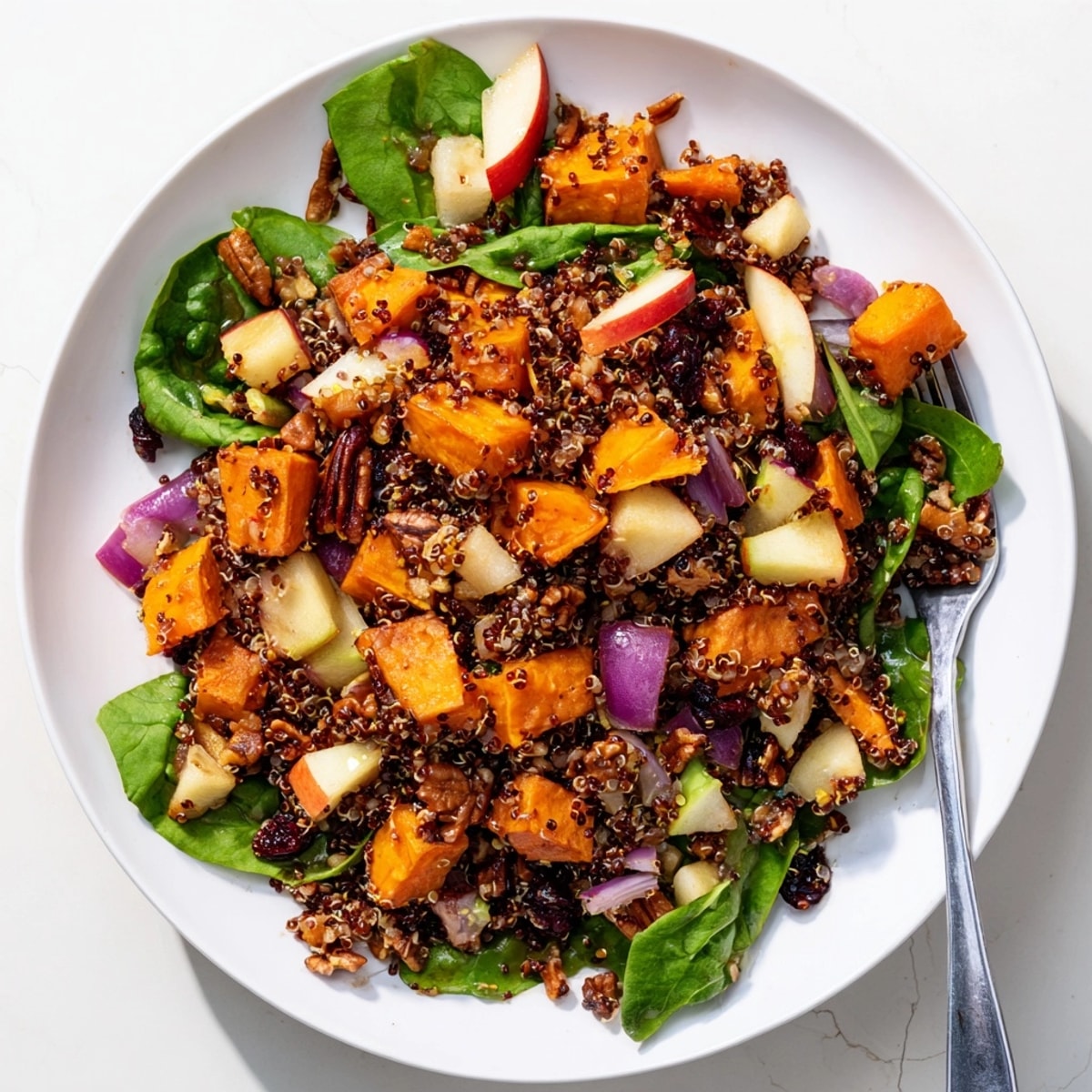 Golden roasted vegetables and fluffy quinoa create a delicious, colorful Quinoa Harvest Salad.