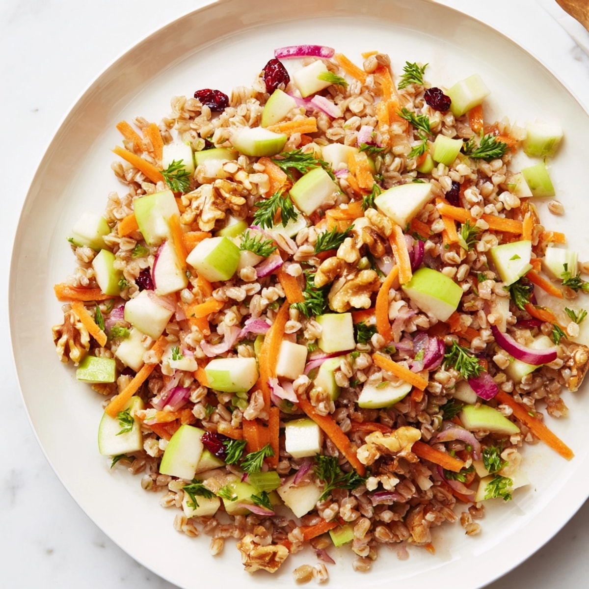Vibrant Farro Apple Crunch Salad in a bowl, ready to serve as a refreshing lunch.