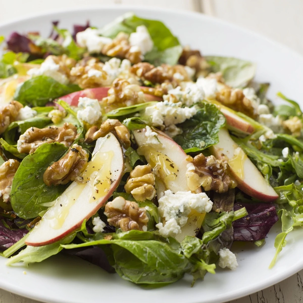 Enjoy a refreshing scoop of this Seasonal Apple Salad, a light and healthy side dish.