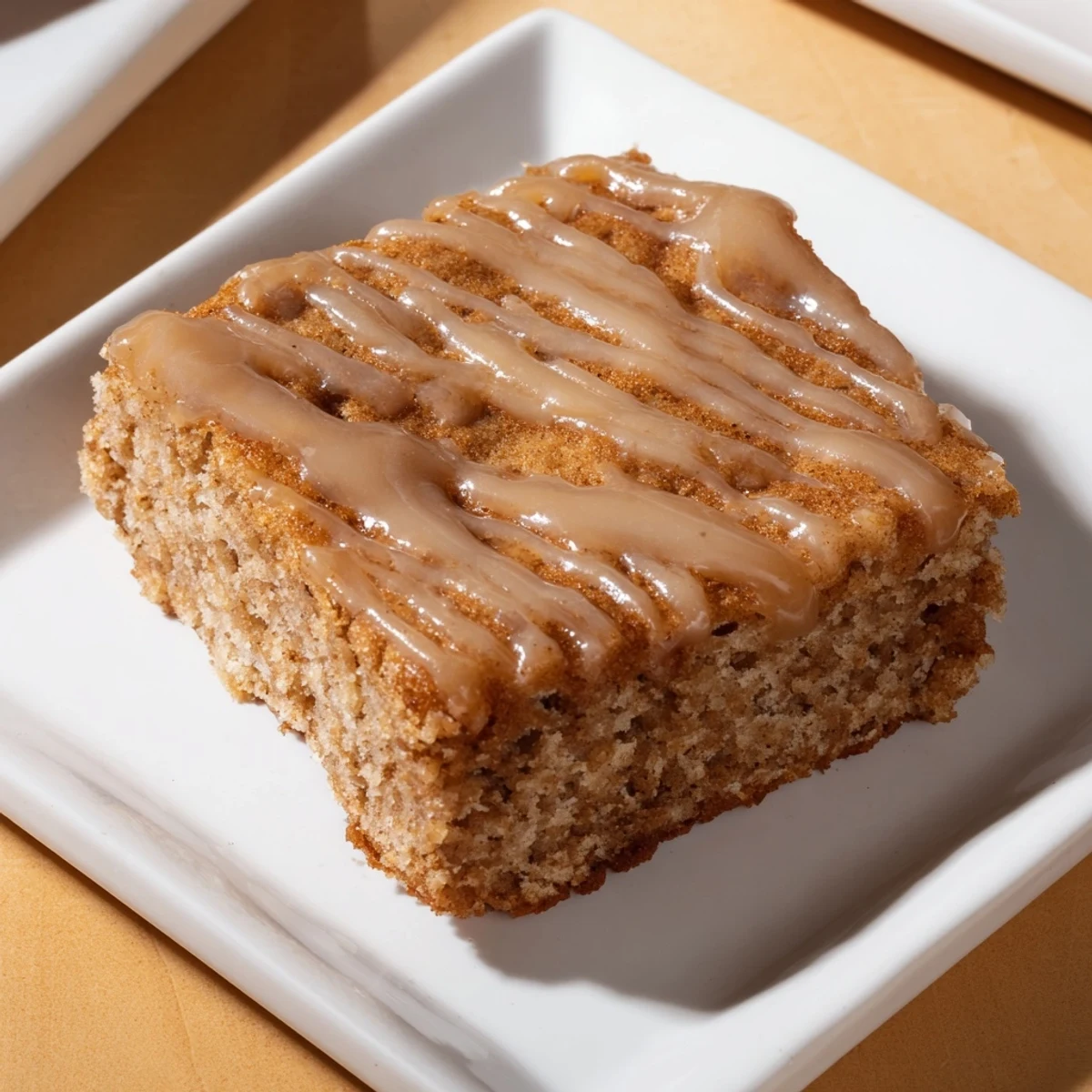 Golden, glazed Seasonal Maple Bars, cut into squares, ready to serve for dessert.