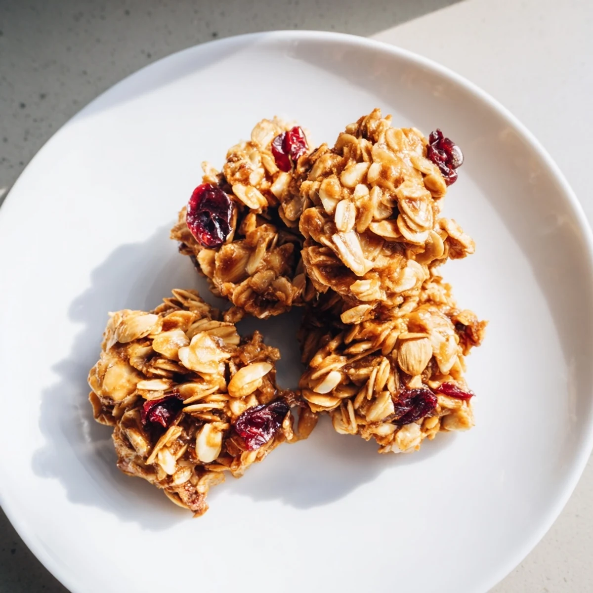 Hearty homemade Warm Oat Clusters with toasted oats, perfect for a crunchy bite with fresh berries.
