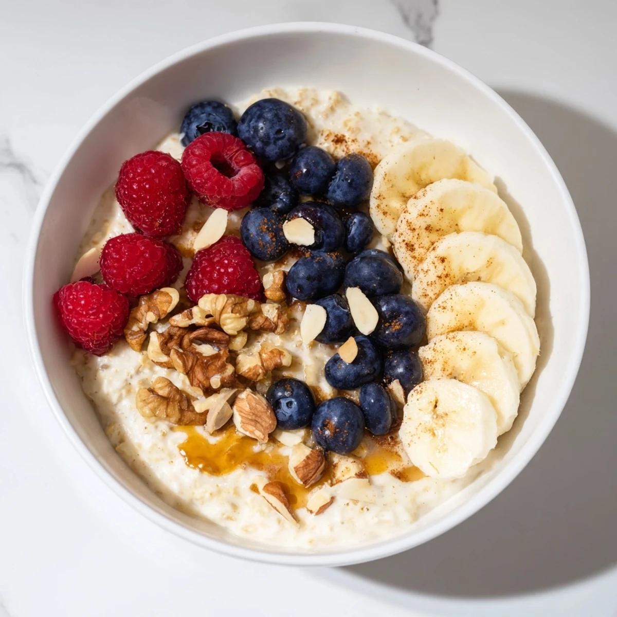 Steaming bowl of cozy oat porridge, a breakfast of creamy oats topped with berries.