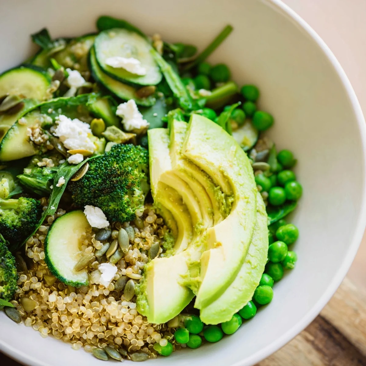 A colorful Warm Green Bowl with vibrant vegetables and avocado, ready to serve and enjoy.