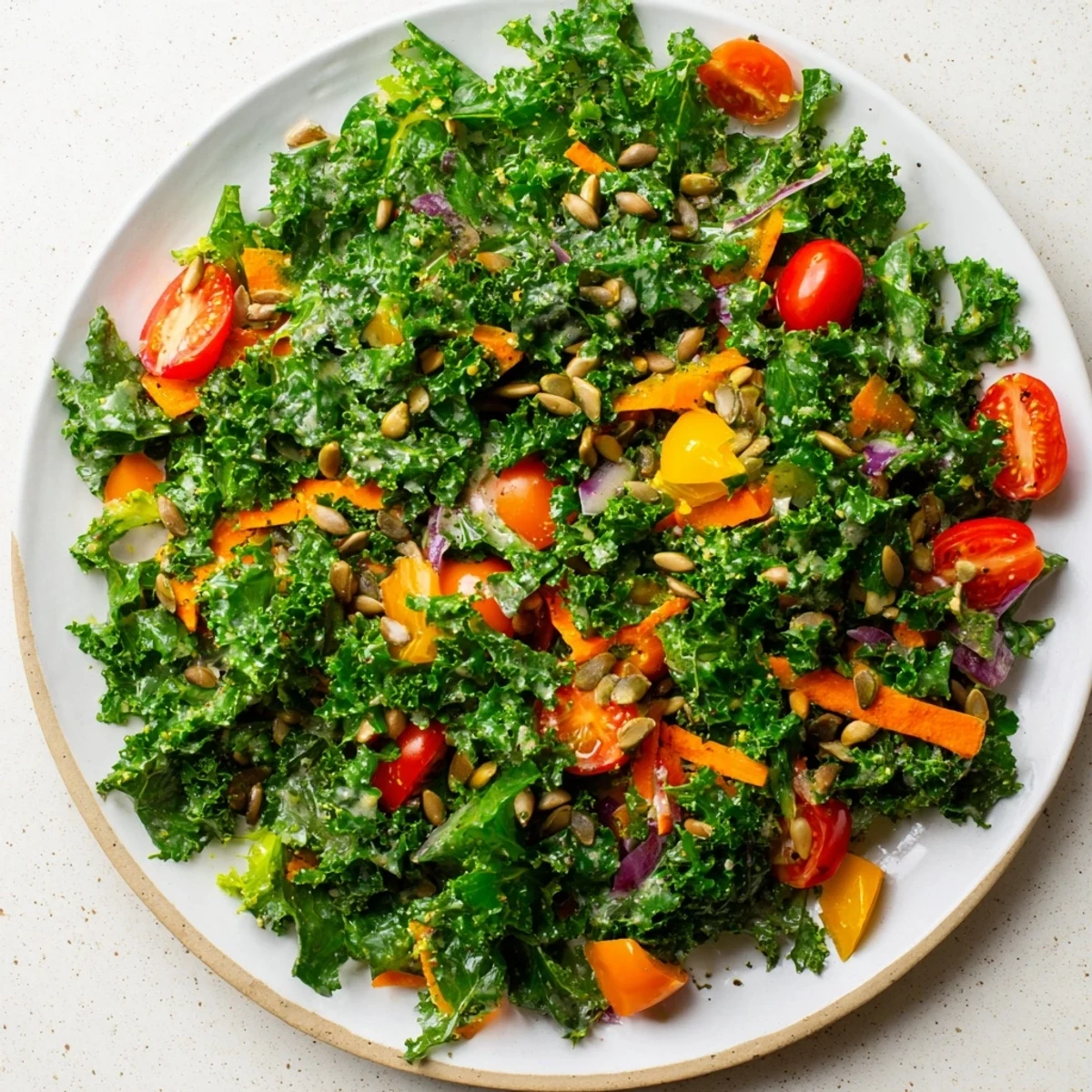 Enjoy a colorful Bright Kale Treat: a vegan salad bursting with fresh vegetables and creamy tahini dressing, delicious!