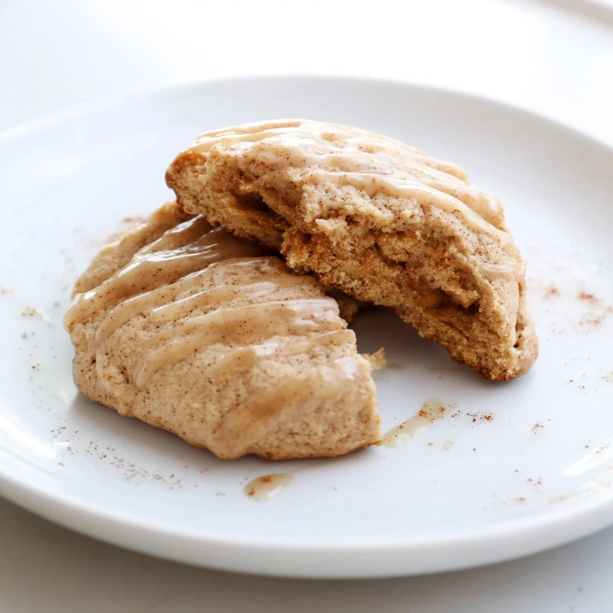 A warm plate of freshly baked Vegan Maple Cookies, smelling of cinnamon and sweet maple syrup.
