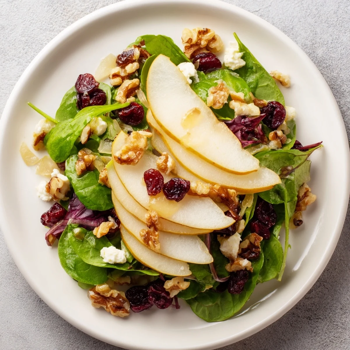 Enjoy a fresh, flavorful Bright Pear Salad with a light vinaigrette - a healthy and beautiful side dish.