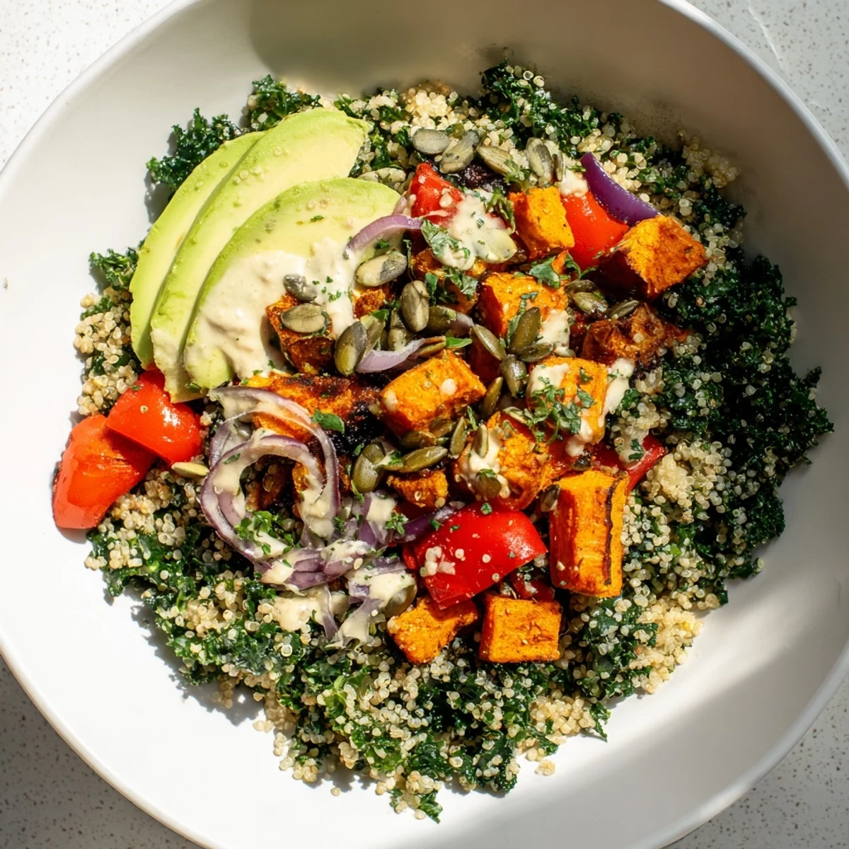 Vibrant Bright Kale Bowl with roasted veggies, dressed in lemon-tahini, ready to enjoy.