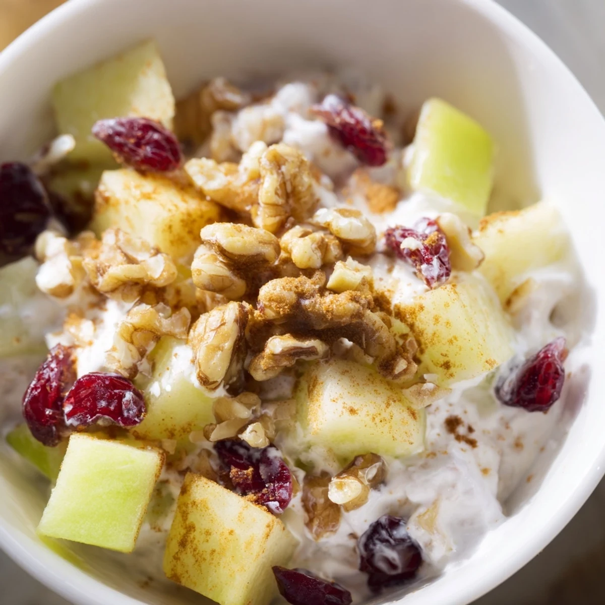 Fresh Apple Treat served in clear glass bowls with creamy Greek yogurt, diced apples, and chopped walnuts.