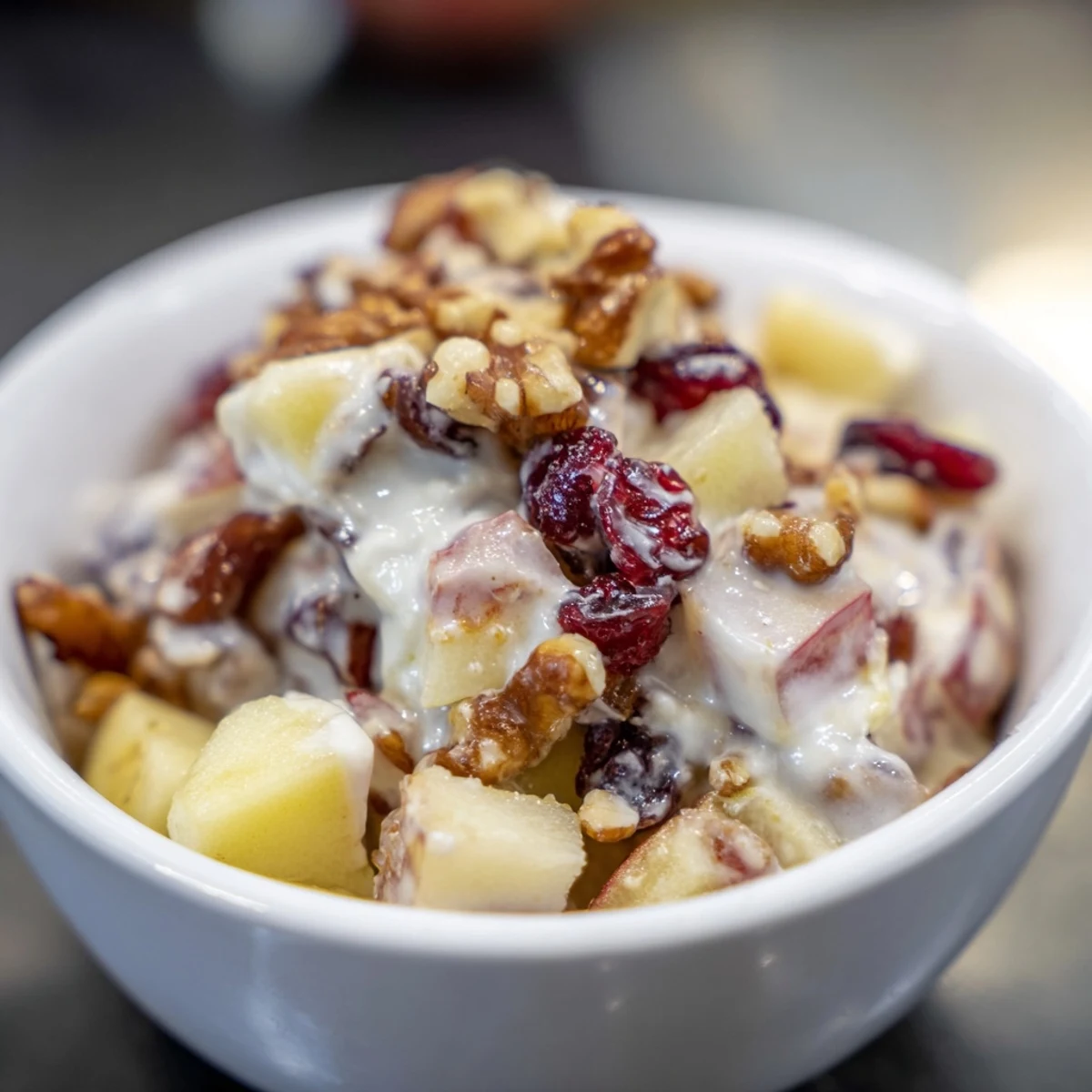 Homemade Fresh Apple Treat with crisp honeycrisp apples, Greek yogurt, and walnuts, ready to serve immediately.