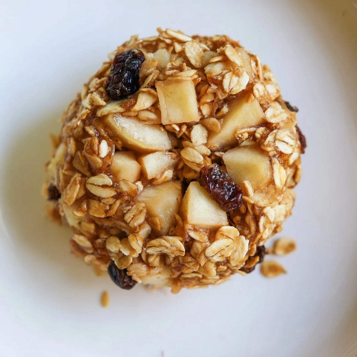 Freshly baked Cozy Apple Clusters cool on a wire rack, showing crispy edges and tender apple pieces.