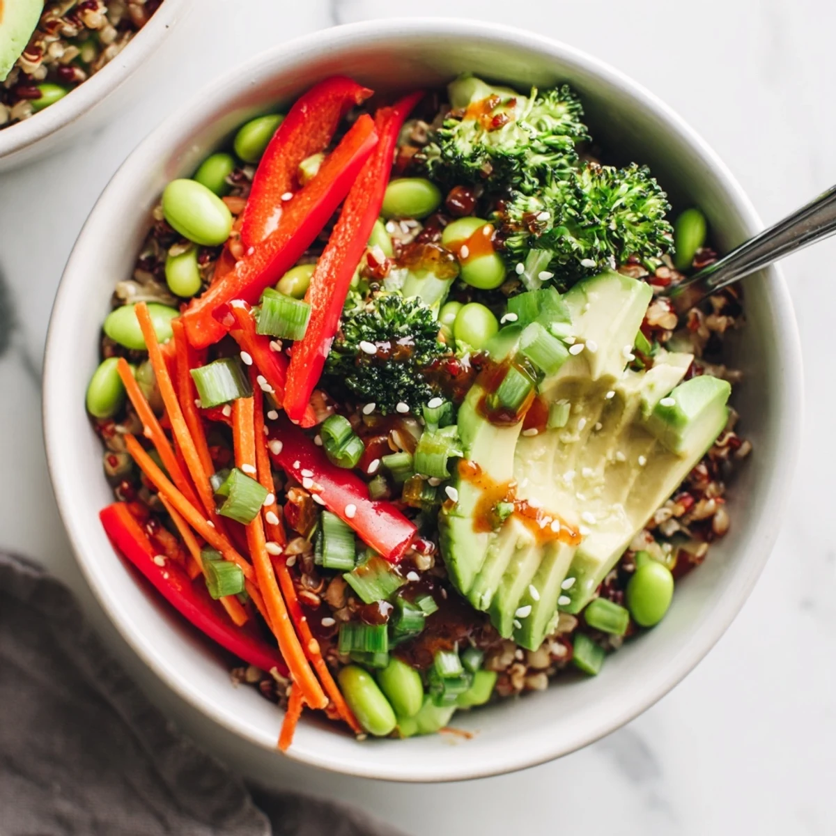 Steamed broccoli and crisp carrots top brown rice in this nourishing Fresh Ginger Bowl, drizzled with a zesty sesame ginger dressing.