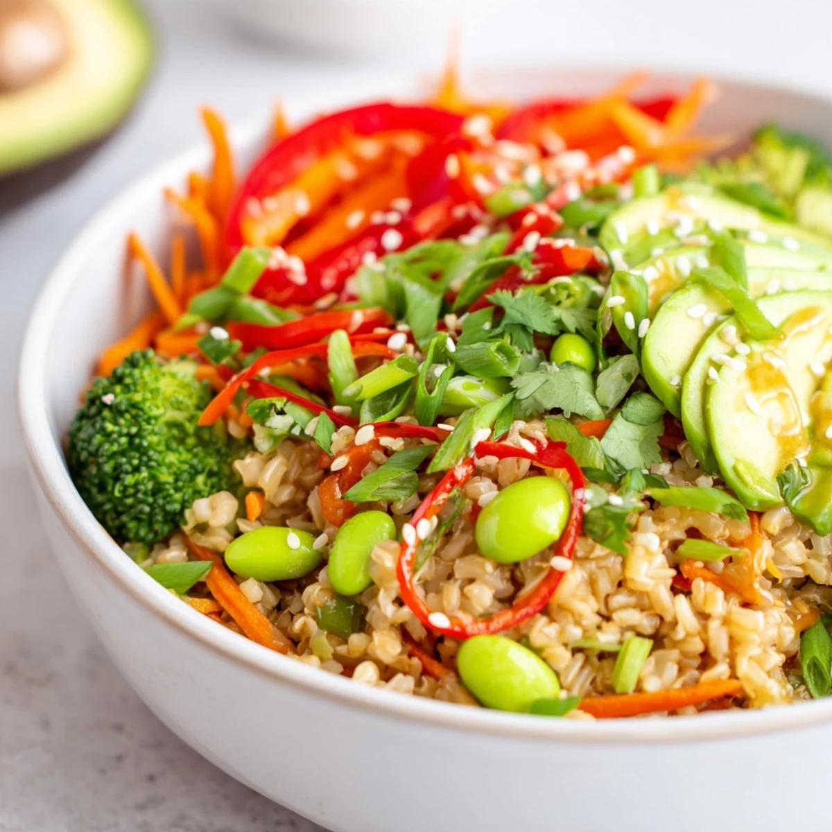 Fluffy quinoa and snap peas make up this easy Fresh Ginger Bowl, featuring a savory homemade ginger soy dressing and sesame seeds.