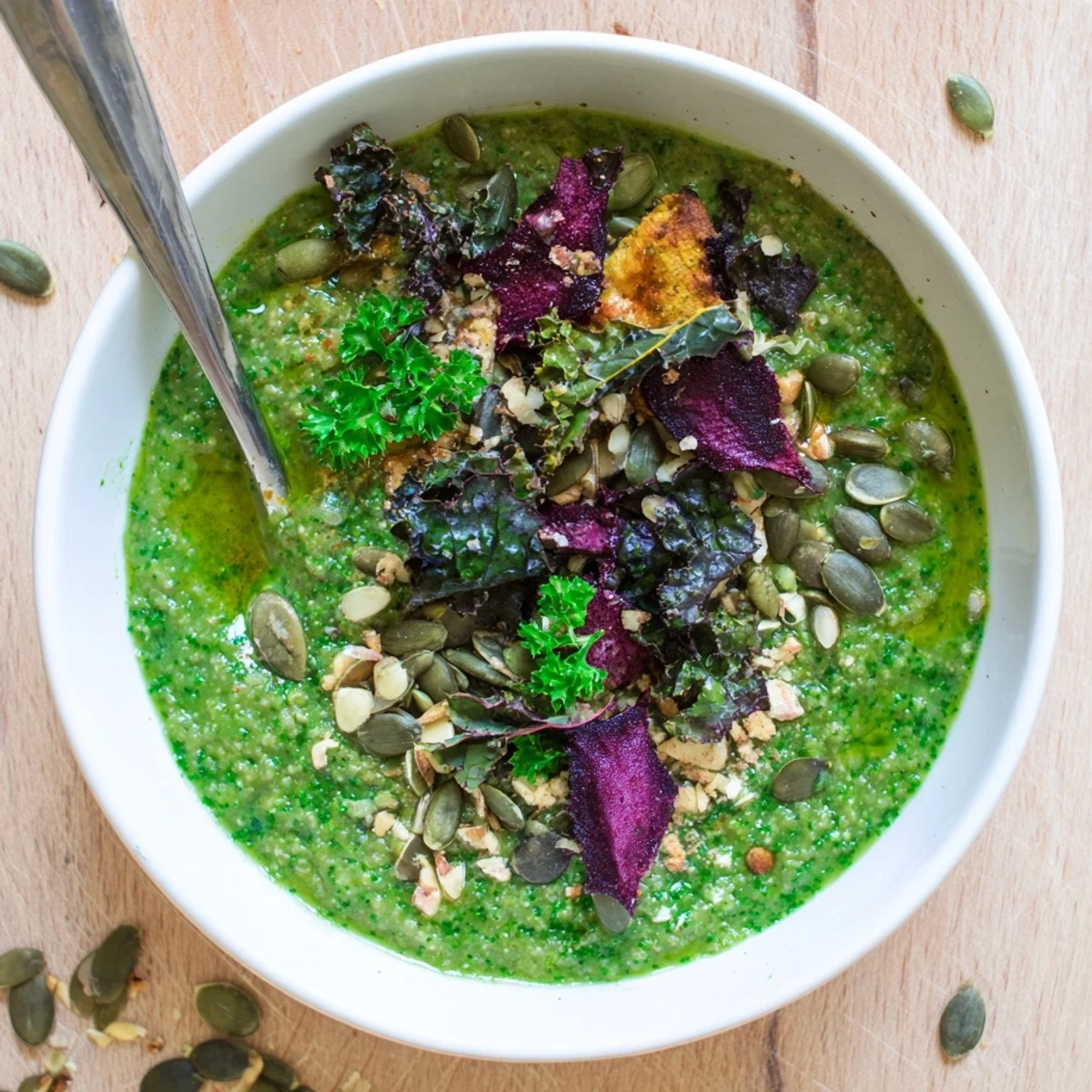 Healthy Crisp Green Porridge, a creamy green breakfast topped with seeds and vegetable crisps.