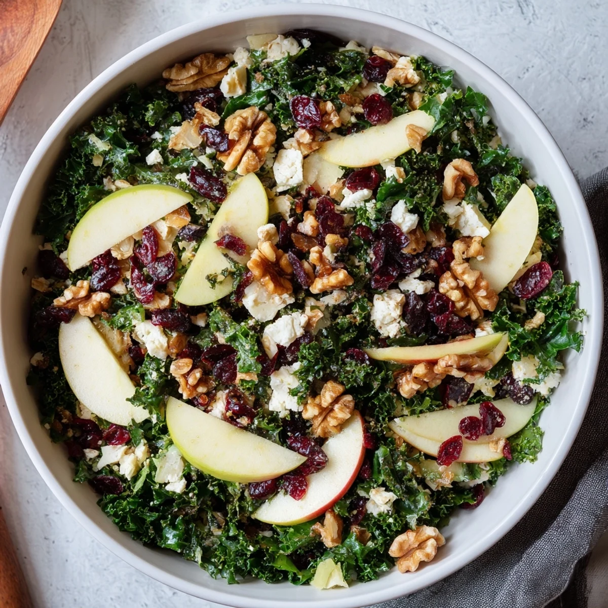 Ready-to-serve New Year Kale Treat, a refreshing vegetarian salad with bright apples and walnuts, perfect for a healthy New Year's meal.