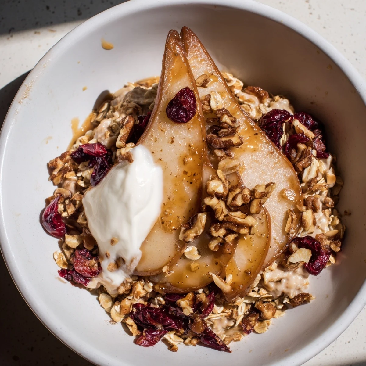 Serve the Cozy Pear Bowl topped with toasted walnuts for a comforting autumn breakfast.
