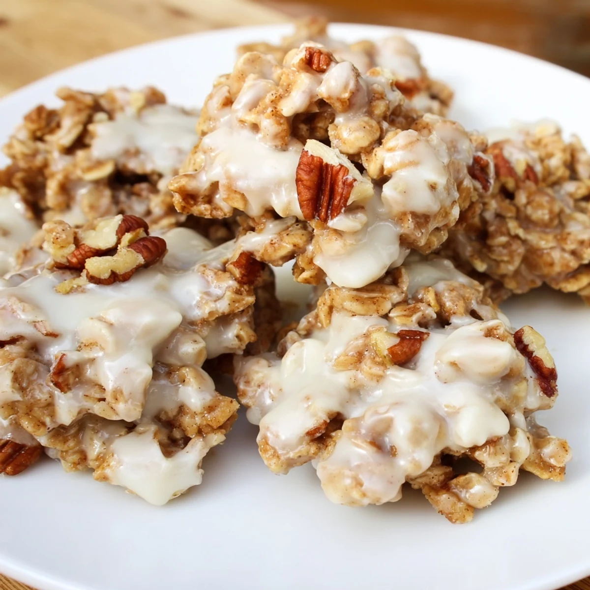 Frosted Ginger Clusters displaying chewy texture with crystallized ginger and toasted pecans on a rustic holiday platter.