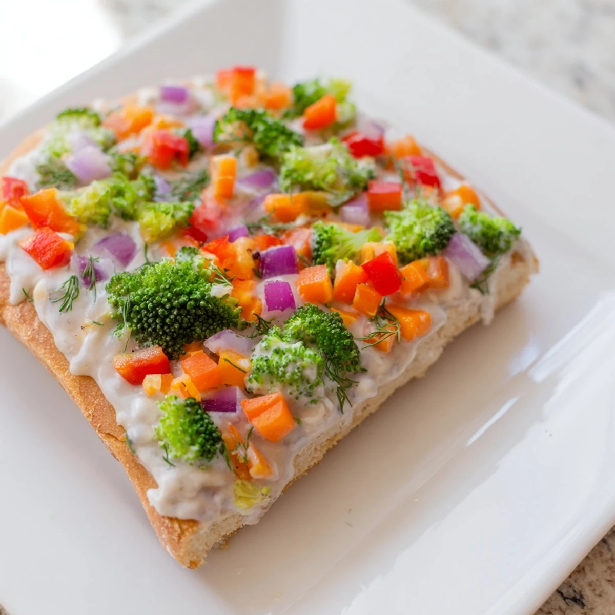 Golden crescent crust holds creamy frosting and crisp fresh vegetable toppings on these Frosted Veggie Bars.