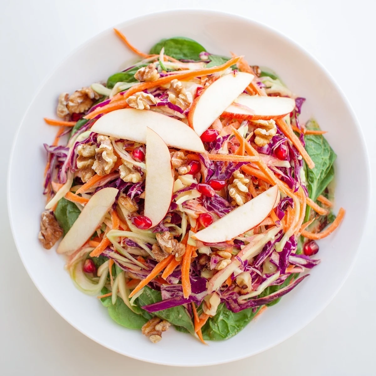 Bright vegan Winter Ginger Salad served in a rustic bowl with crisp fennel and spinach, perfect for winter.