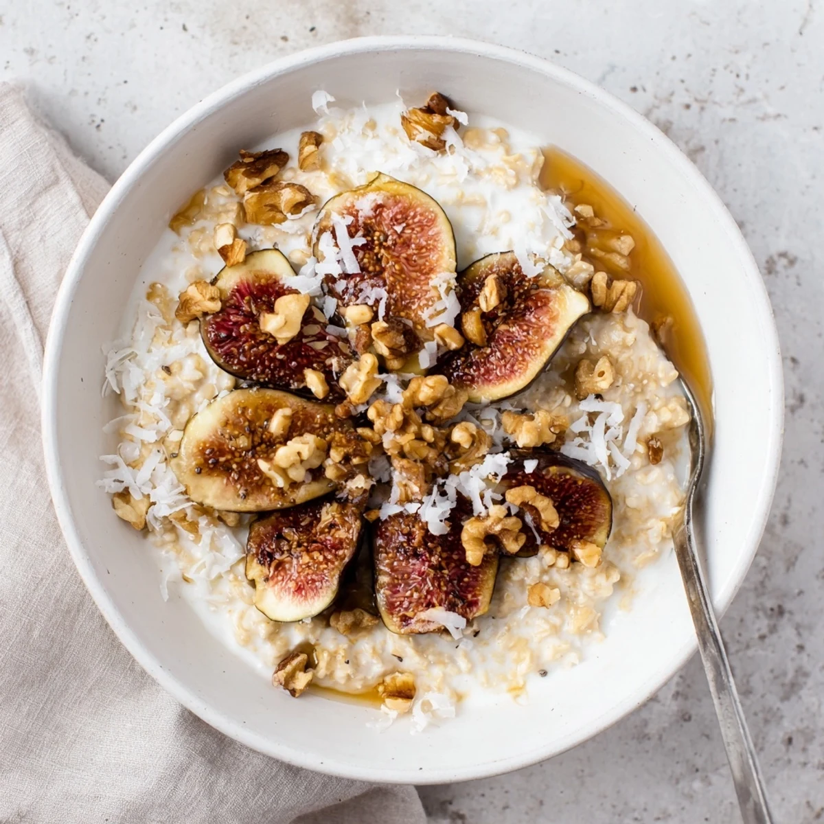 Glass jar of vanilla fig overnight oats layered with yogurt, chia seeds, and ripe figs