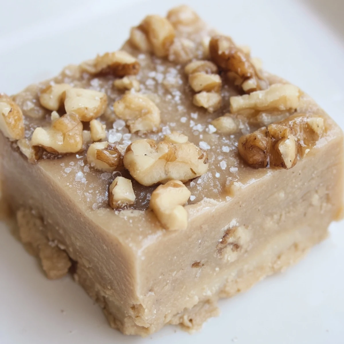 Creamy salted maple walnut freezer fudge squares topped with crunchy walnuts and sea salt
