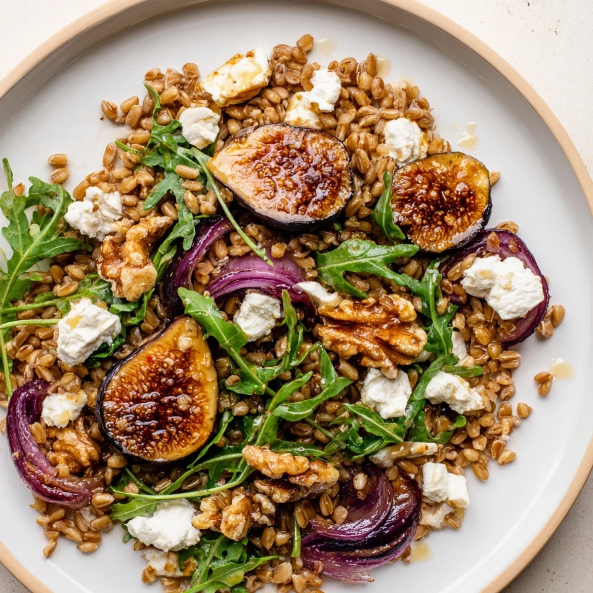 Golden roasted figs and crunchy walnuts top this Mediterranean farro grain salad