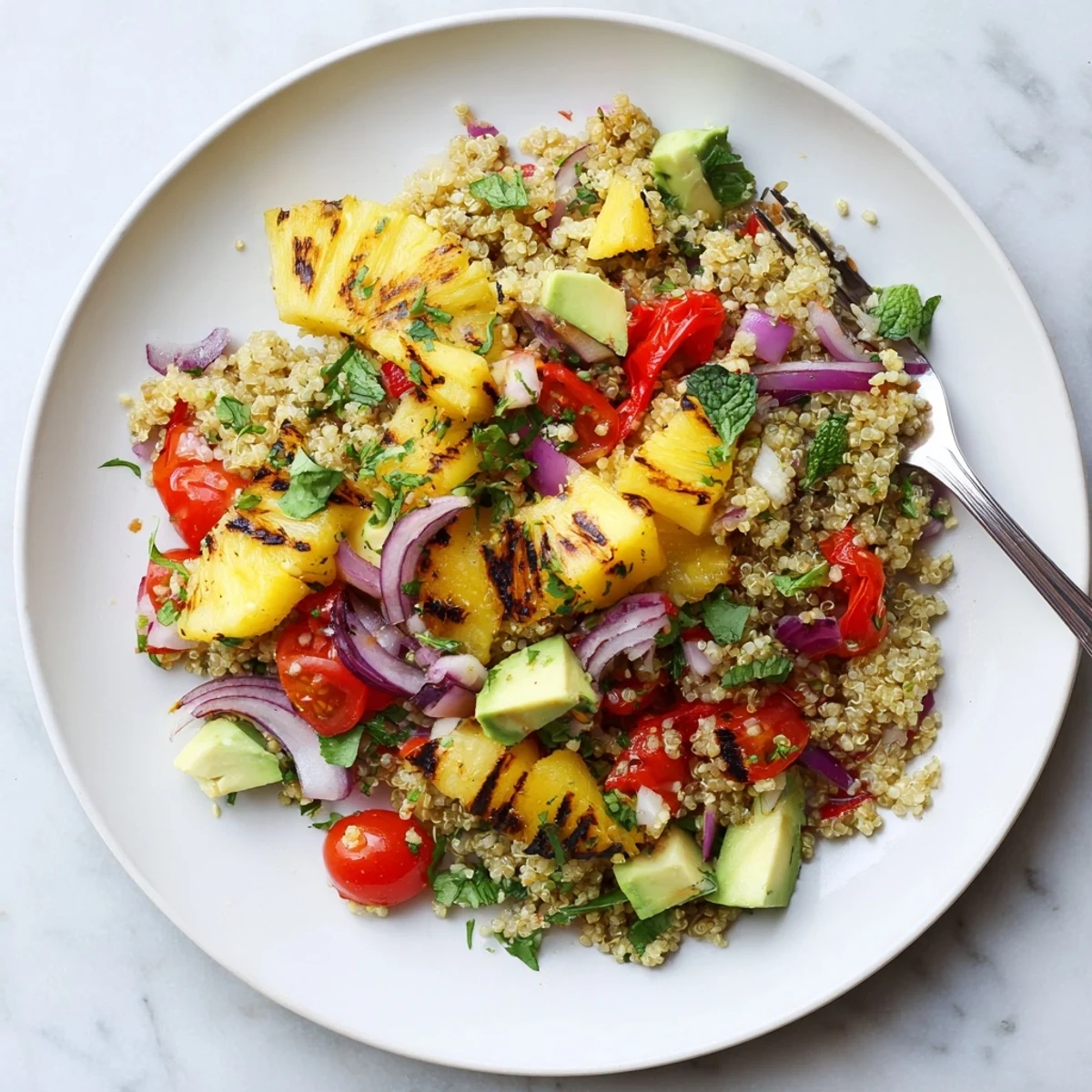 Summer healthy grilled pineapple chili quinoa grain salad featuring smoky pineapple chunks and crisp vegetables