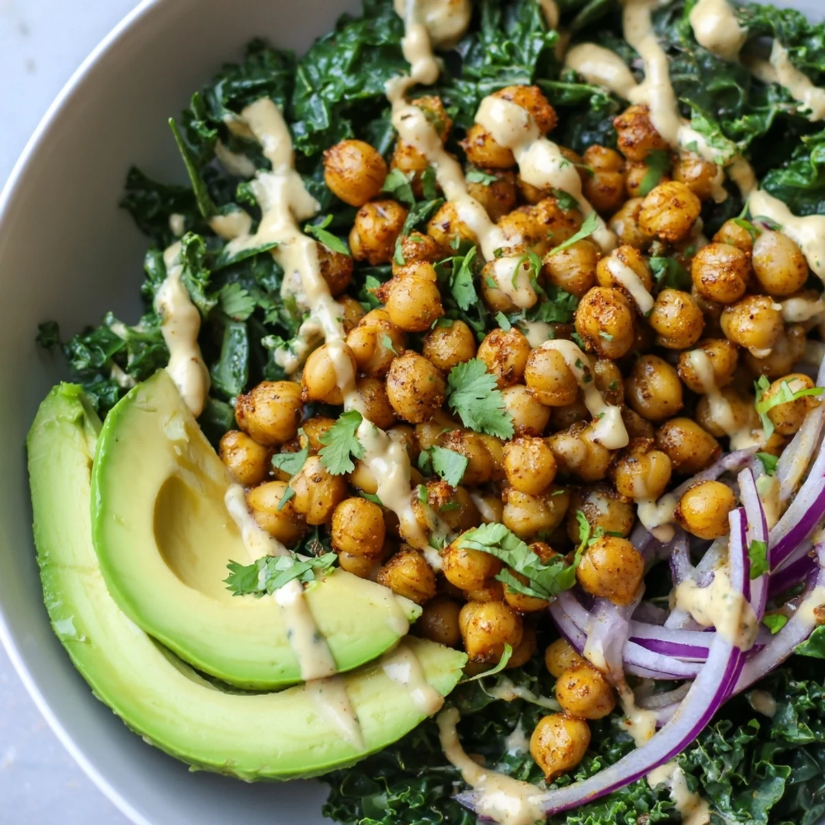 Warm cumin seasoned chickpeas nestled with sautéed kale in this nourishing Savory Spiced Chickpea and Kale Breakfast Bowl