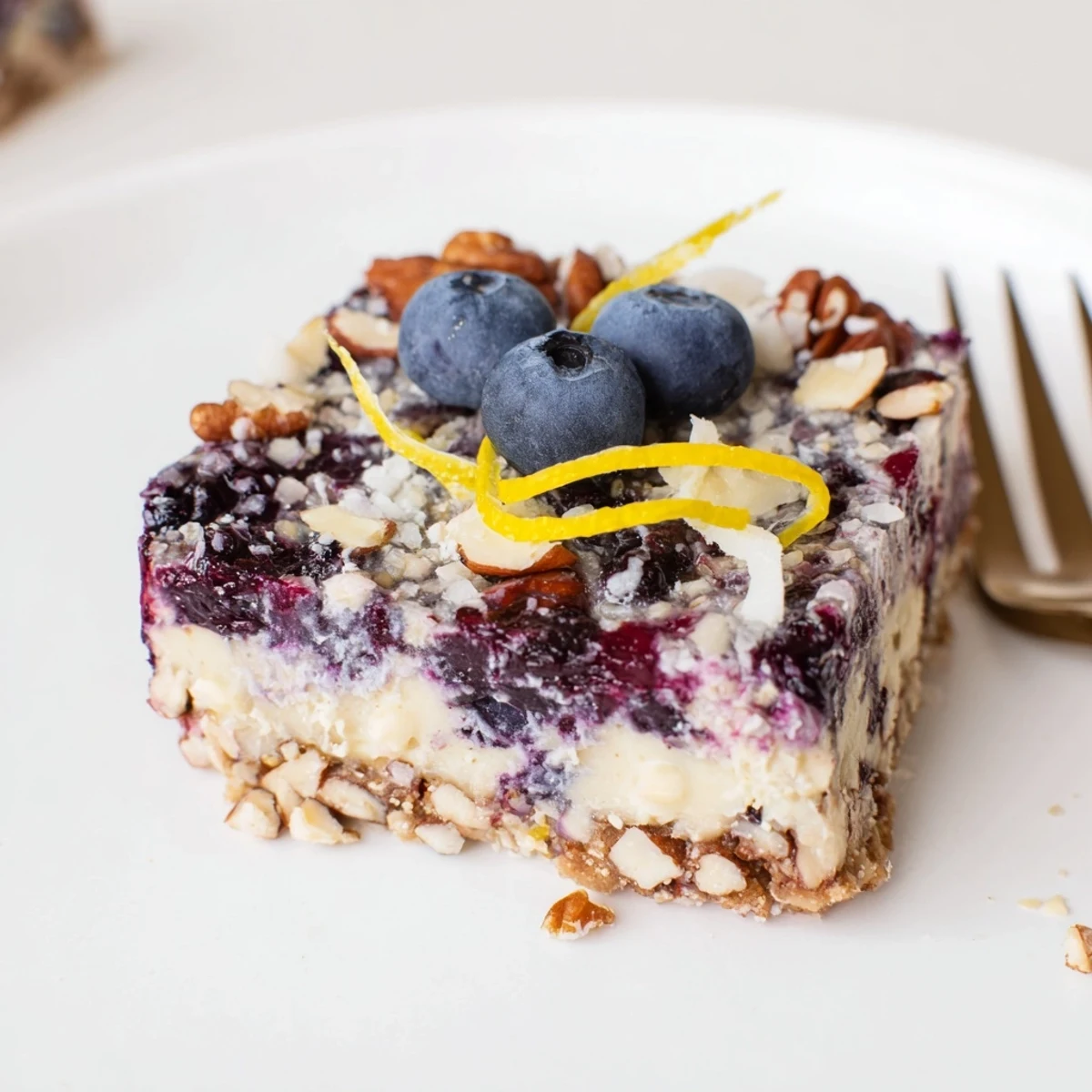 Blueberry Lemon Cashew Cream Bars served frozen, nutty crust and silky cashew filling