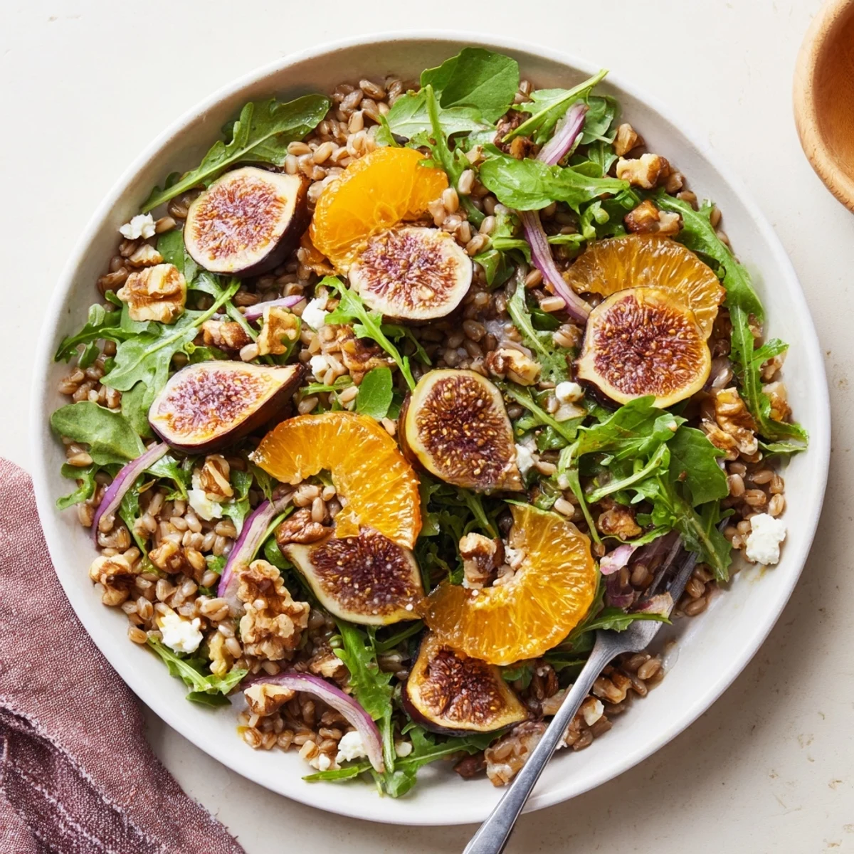 Bright Roasted Fig and Orange Farro Grain Salad tossed with peppery arugula, toasted walnuts
