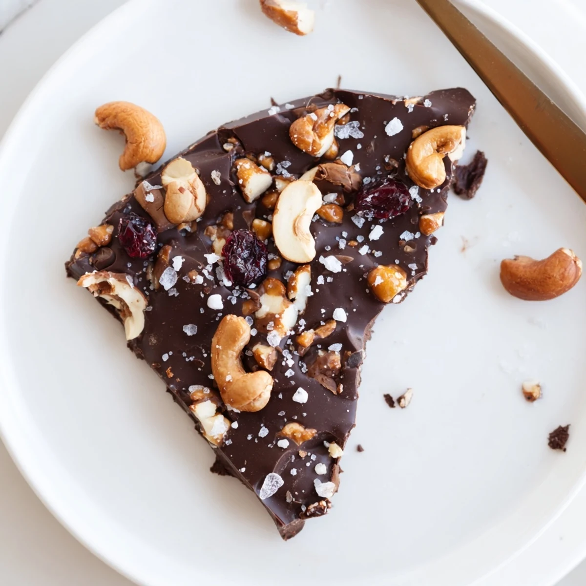 Dark Chocolate Cashew Crunch Bark sprinkled with flaky sea salt, glossy shards