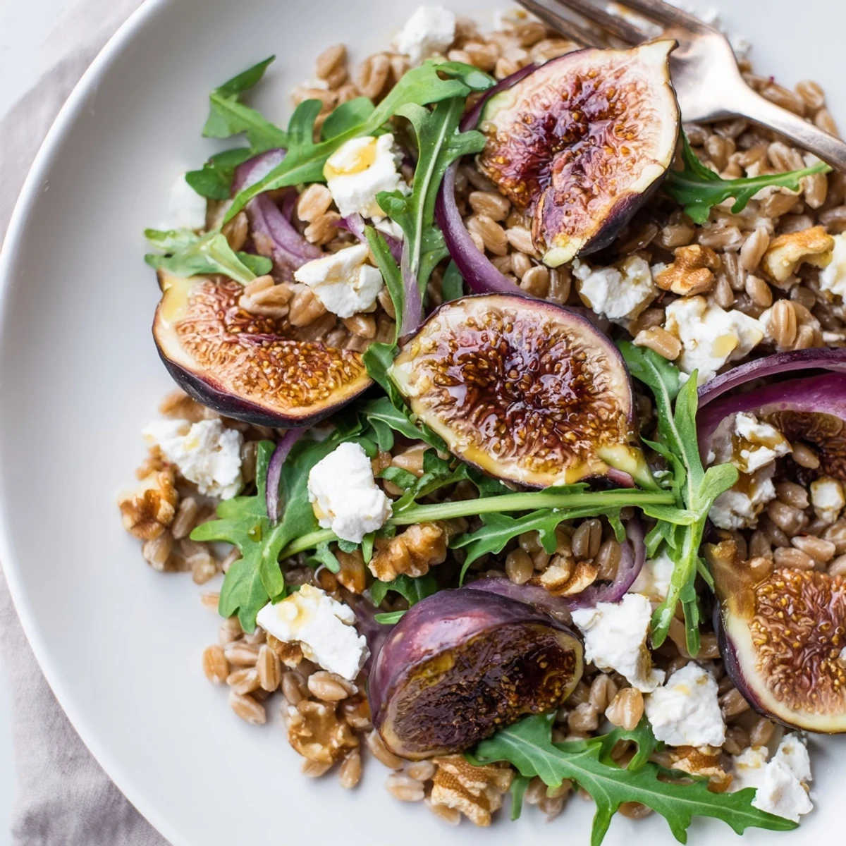 Golden roasted figs and nutty farro tossed with fresh arugula in a zesty lemon dressing