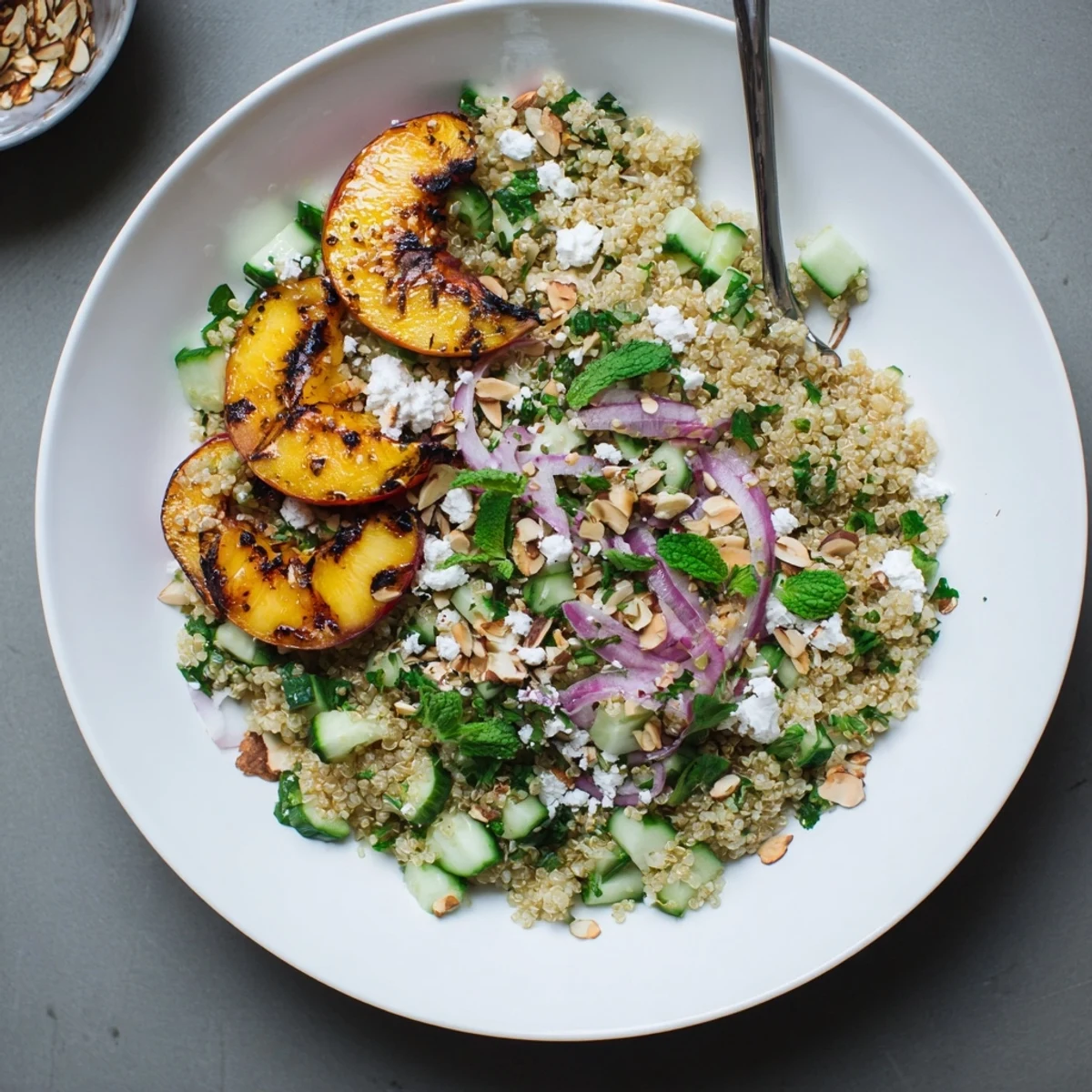 Light grilled nectarine mint quinoa grain salad sprinkled with feta and toasted almonds