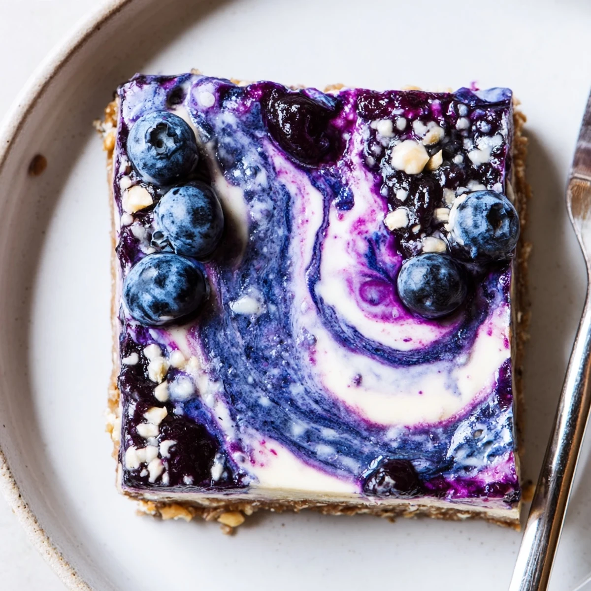 Blueberry Lemon Cashew Cream Bars velvety lemon cashew filling atop a nutty date crust.