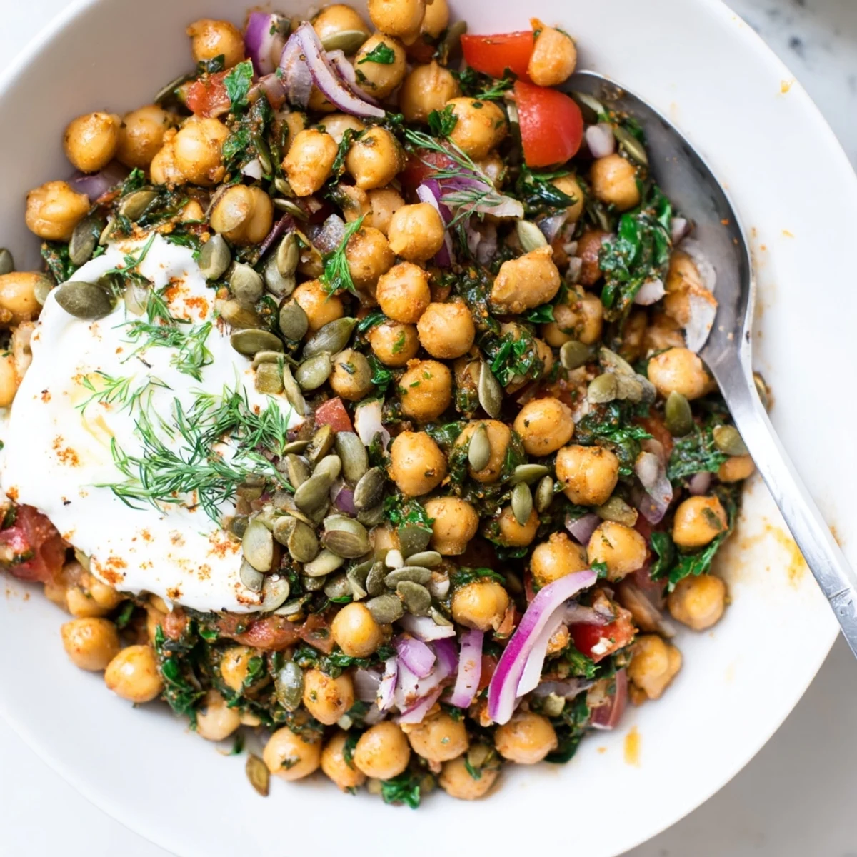 Bright lemon and herbs awaken Savory Herbed Chickpea and Spinach Breakfast Bowl.