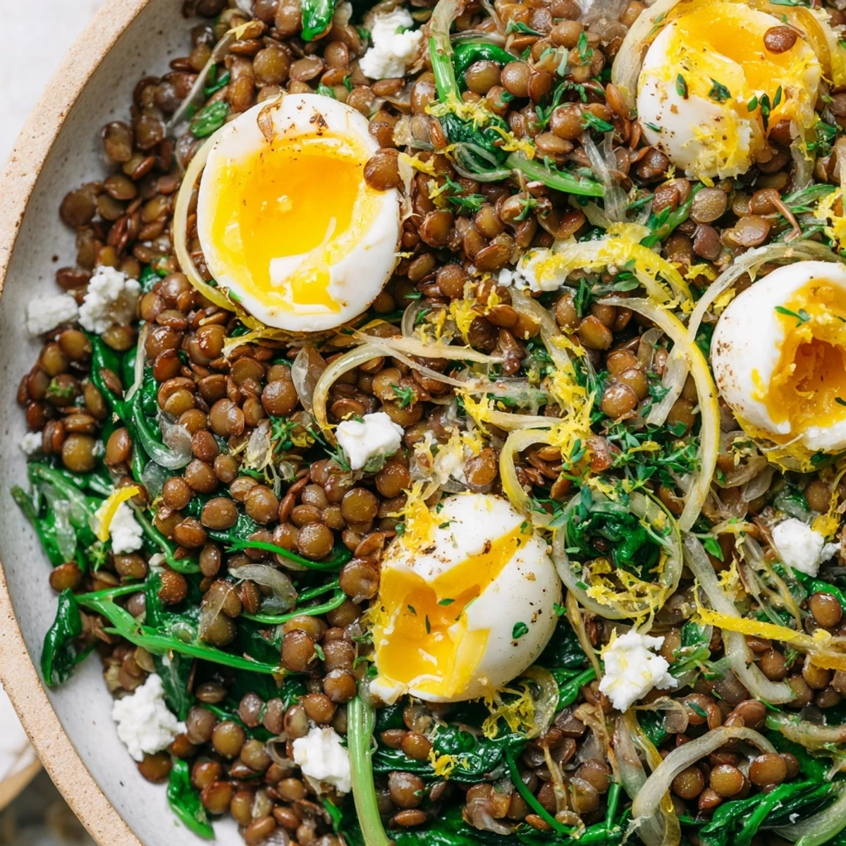 Savory Lemon Garlic Lentil and Spinach Breakfast Bowl tossed in zesty lemon garlic dressing
