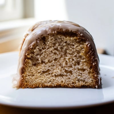 A serving of Cozy Maple Bars drizzled with rich glaze, ideal with a hot cup of coffee.