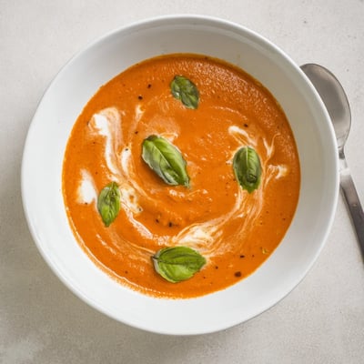 This cozy bowl of Creamy Roasted Tomato Basil Hearty Soup pairs perfectly with a grilled cheese sandwich.
